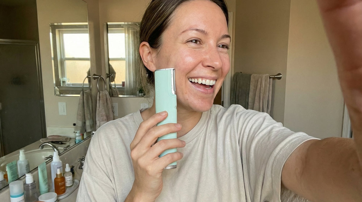 Silver-haired woman getting ready in a warm, bright bathroom